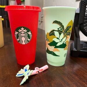 Red and green Starbucks reusable cups w/ Canna Lily Butterfly straw topper